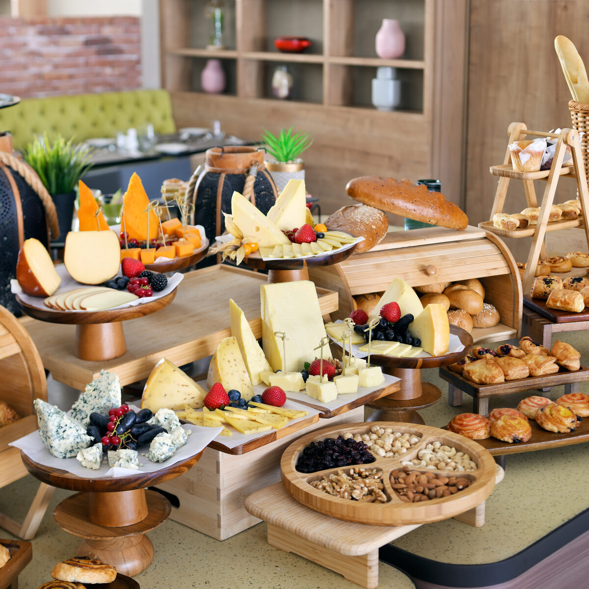 Artisan bread, pastry, and cheese breakfast buffet styled by H-Gourmet