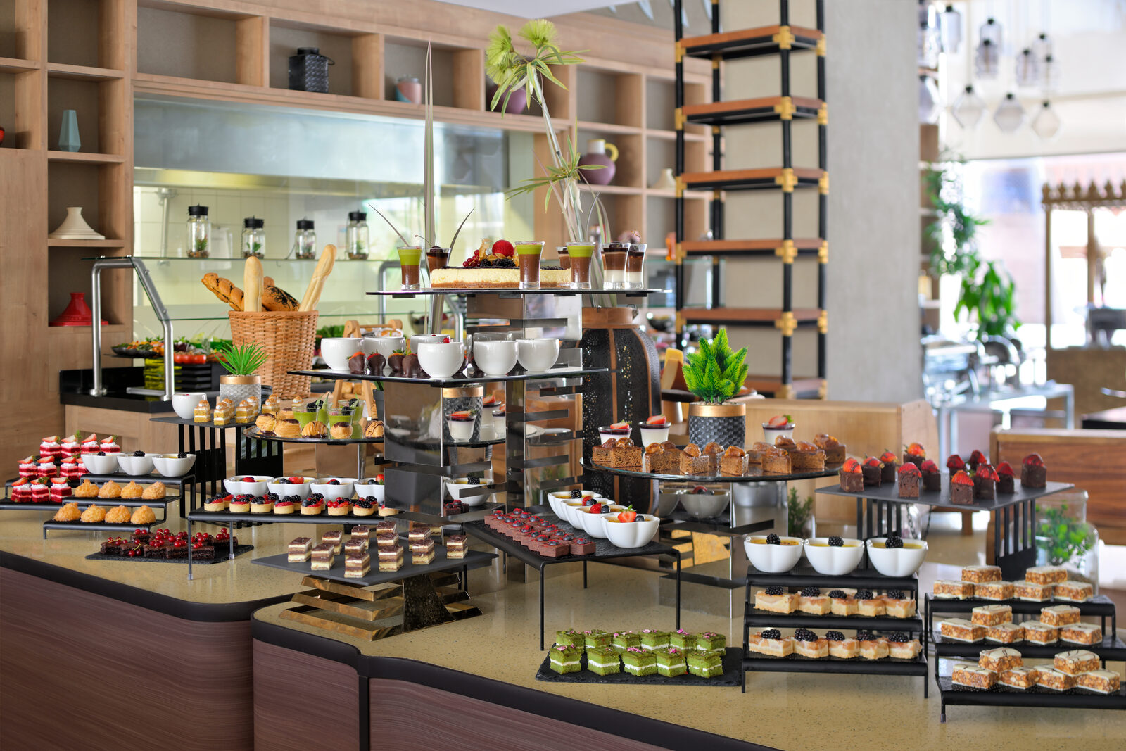 Lavish H-Gourmet dessert and pastry buffet display in a five-star hospitality setting